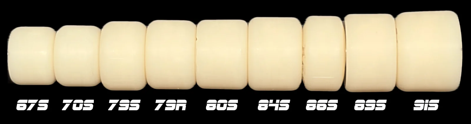 Nine cream-coloured Bloob wheels in a row, seen from the side, labelled 67s, 70s, 79s, 79R, 80s, 84s, 86s, 89s and 91s. They get taller from left to right, and their widths vary.