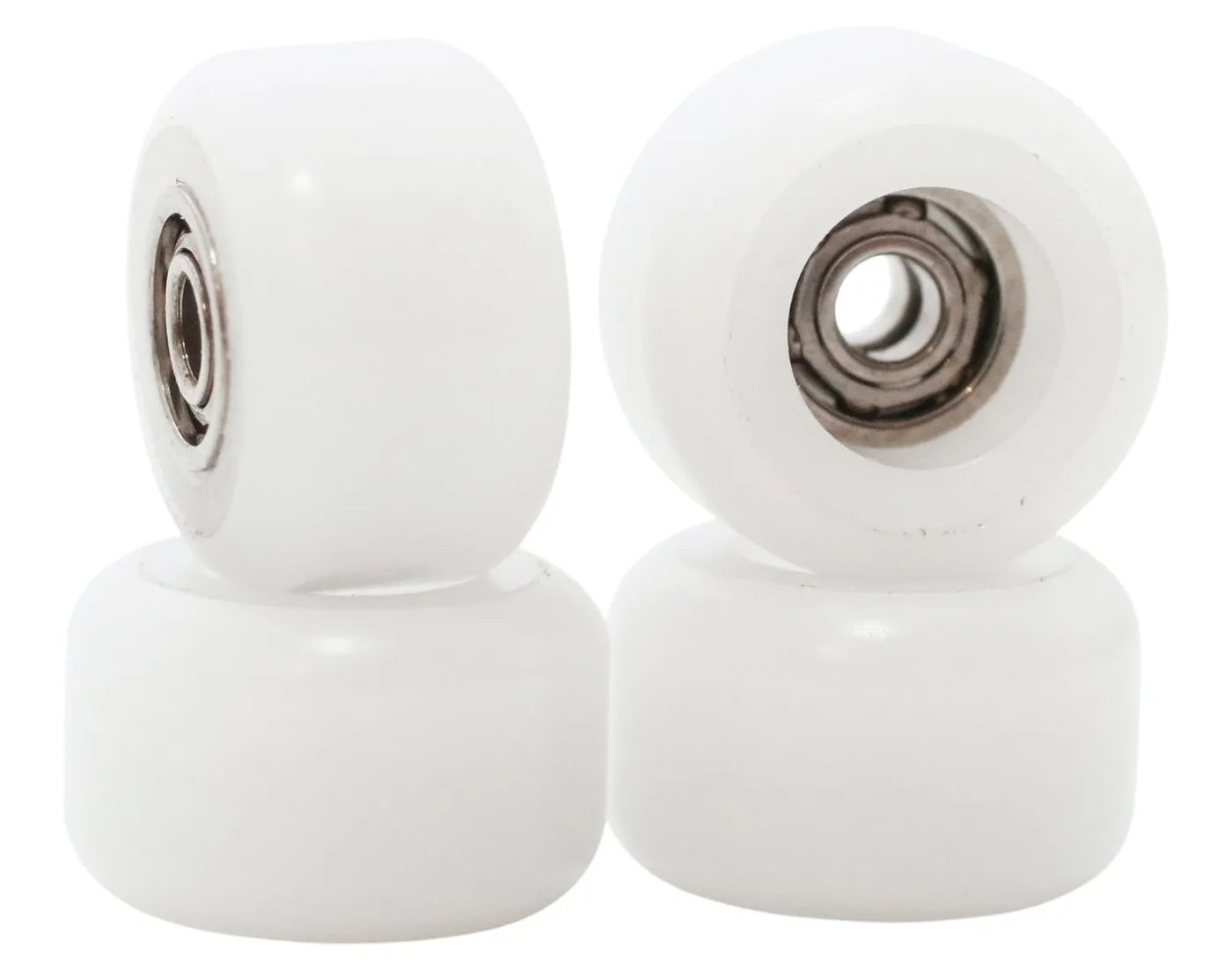 Two stacks of white FlatFace dual bearing wheels. The top wheel on the left is turned to show a bearing in its side; the top wheel on the right shows a bearing set into a recess in its face.